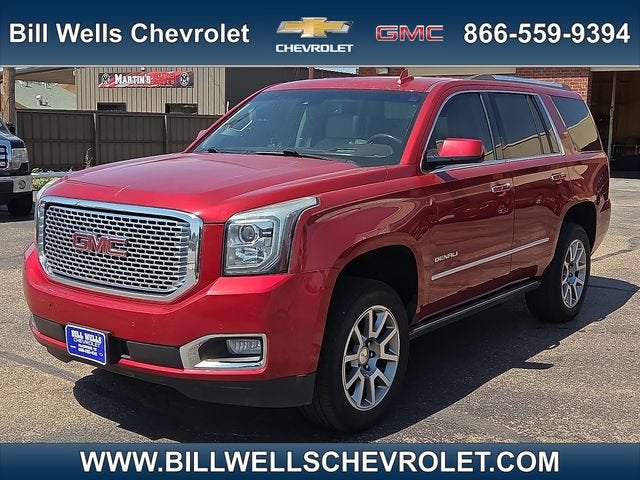 2015 GMC Yukon Denali in Crystal Red Tintcoat — front three-quarter view