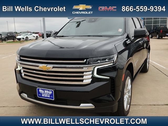2023 Chevrolet Suburban High Country in Black — front three-quarter view